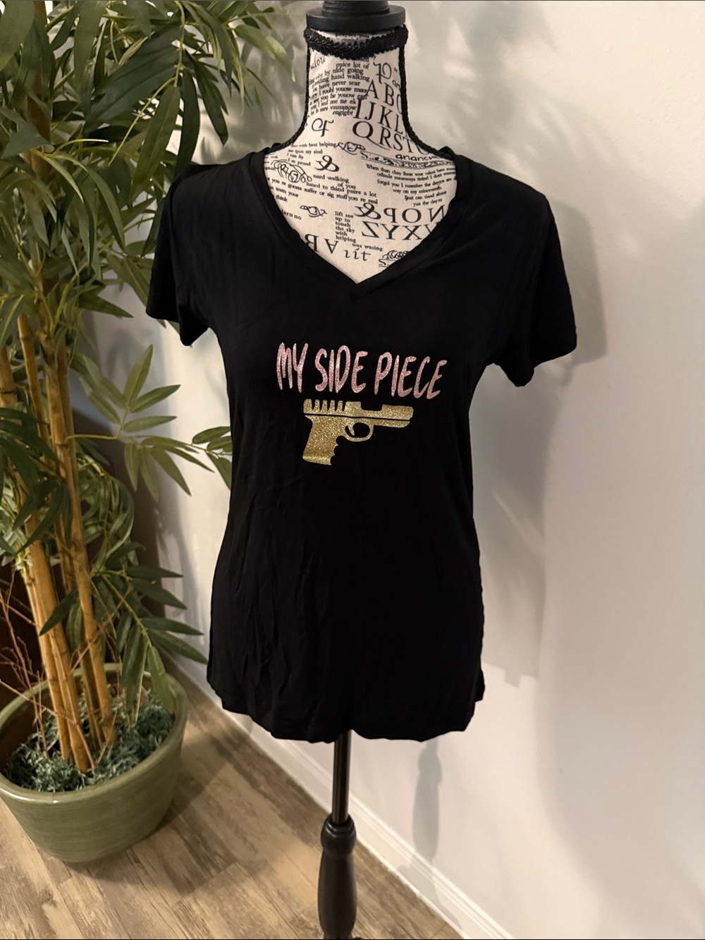 New. Black V-Neck Graphic Tee with Pink Script and Gold Accent
